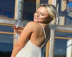 Emily Atack consuming alcohol